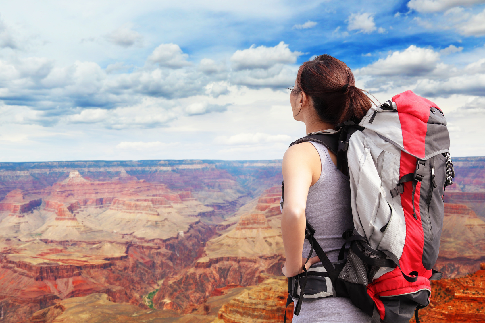 Traveler with backpack at Grand Canyon